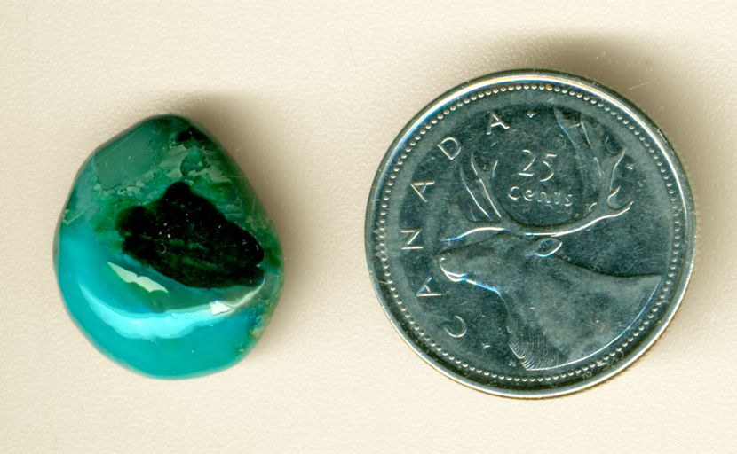 Bright blue and green patterned cabochon in Chrysocolla-in-Chalcedony from the Inspiration Mine in Globe County, Arizona.