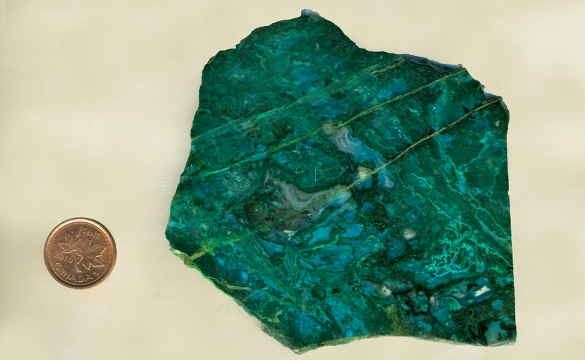 A blue and green slab of Agatized Chrysocolla (Chrysocolla-in-Chalcedony) with fortification patterns and stripes of Malachite.
