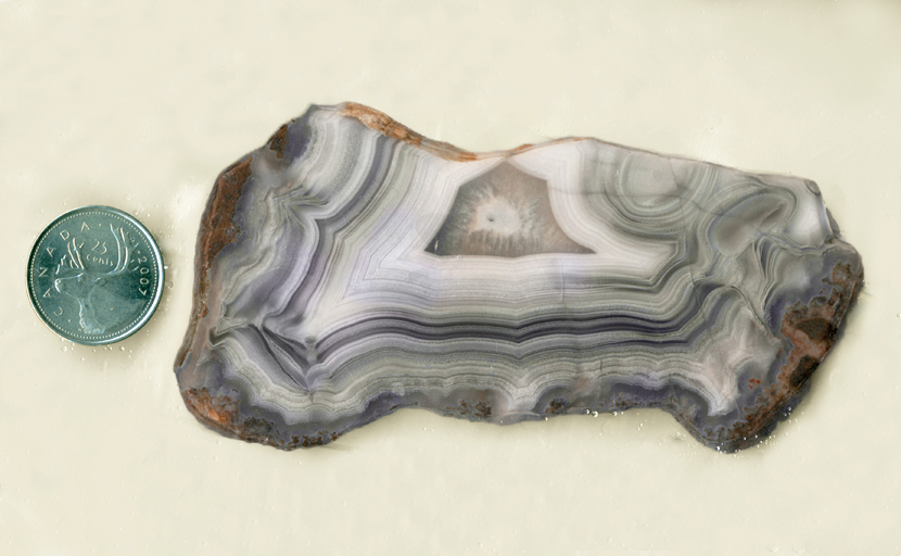 Purple, violet, gray and white Parcelas Agate from Mexico with a bold fortification pattern.