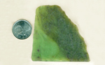 Bright apple-green slab of Jade from Wyoming with grass inclusions.