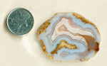 Blue, yellow, pink and orange slab of Mexican Snowball Agate, with two fortification patterns.