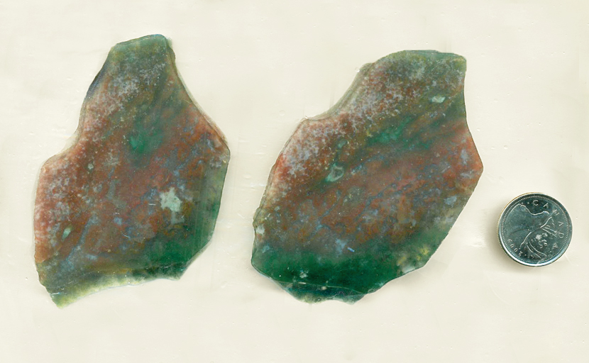 Green and red cloud patterns in 2 translucent slabs of Pink and Green Moss Agate from India.