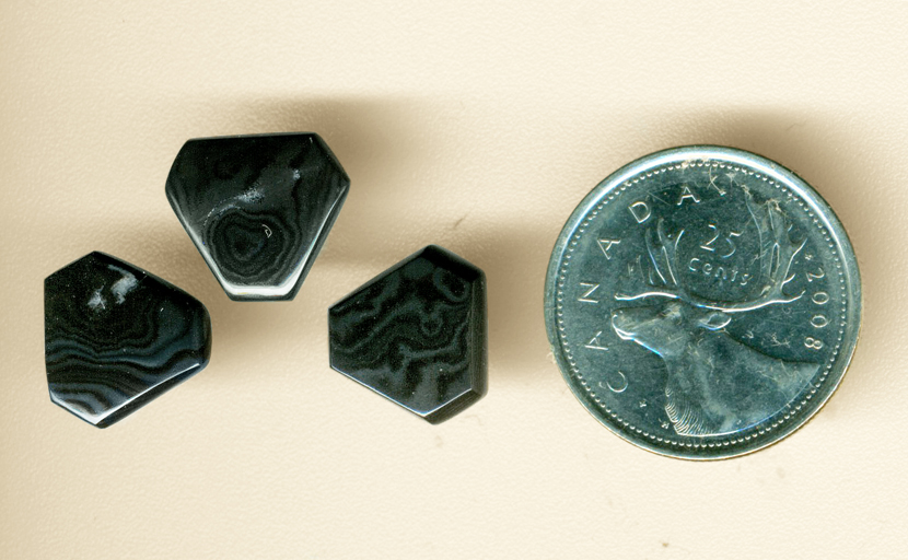 3 hexagonal polished gems of Psilomelane (Merlinite), patterned in flowing black and silver shades.