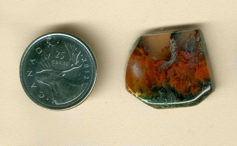 Freeform polished Mexican Flame Agate, with black ground and swirling red flame patterns tipped with black smoke.