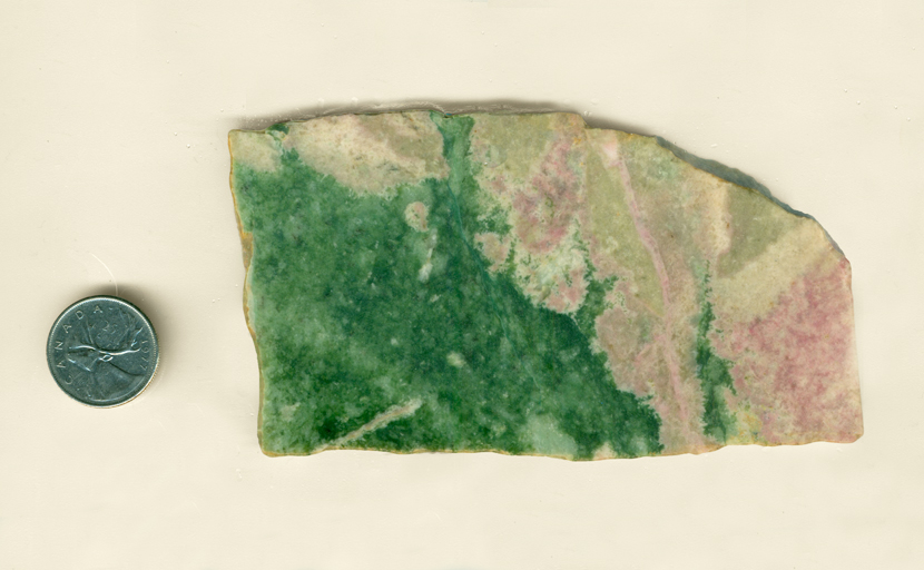 A slab of Pink and Green Jade from Wyoming, equal parts pink Thulite and Green Jade, joined in an uneven line. 