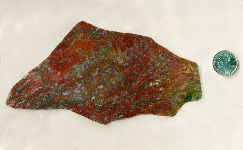 Deep red and green moss inclusions in a Laredo Moss Agate from Texas.