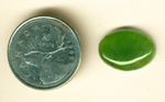 Grass-green oval Nephrite Jade cabochon, with grass-like details.