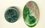 Half green Jade and half pink Thulite in a large cabochon of Pink and Olive Jade from Wyoming.