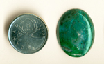 Bright blue and green streamers preserved by agate in a cabochon of Chrysocolla-in-Chalcedony.