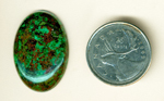 Spangles of green and orange in a bright cabochon of Cuprite and Malachite from Arizona.