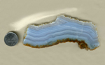 A slab of Blue Lace Agate from Namibia, with bright blue stripes in borders of reddish brown.
