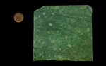 A square slab of Emerald Snowflake Jade, mottled green, heavy and dense.